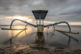 Jukung in the sea, typical landscape shot with a view of the horizon over the water, taken from a