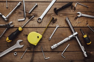 Flat lay with DYI composition of various work, carpentry tools knolled on brown wooden decks