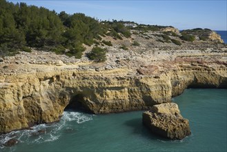 Wild beach nature landscape with turquoise water in Benagil Algarve, Portugal, Europe