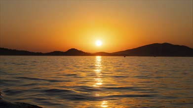 Evening sun over the sea, in front of sunset, island world off Vodice, Dalmatia, Croatia, Europe