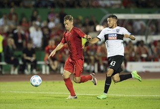 Football match, Joshua KIMMICH FC Bayern Munich left on the ball, Romario RÖSCH SSV Ulm tries to