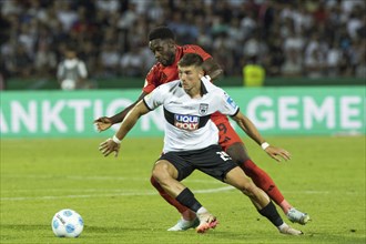 Football match, Semir TELALOVIC SSV Ulm on the ball, Alphonso Boyle DAVIES FC Bayern Munich tries