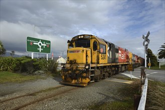 HOKITIKA, NEW ZEALAND, AUGUST 29, 2020: A freight train crosses the main street of Hokitika near