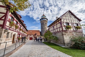 Imperial castle with fountain house and Sinwelt tower, half-timbered houses in the castle, in