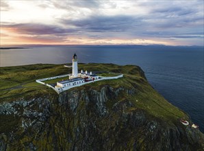 Sunset over Mull of Galloway Lighthouse from a drone, Mainland Scotland, Scotland, UK