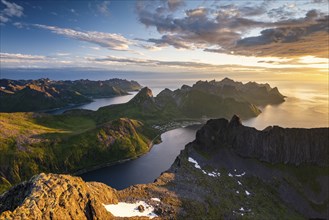 View over Senja's fjords and mountain peaks under the midnight sun, Mount Grytetippen, Senja,