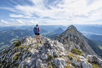 Hiker on a ridge in the mountains, Schaffauer, Wilder Kaiser, Tyrol, Austria, Europe