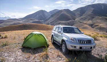 Toyota Landcruiser and tent on a hill, Chuy province, Kyrgyzstan, Asia