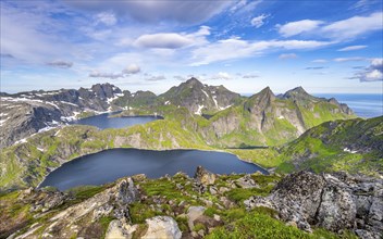 Mountain landscape with steep rocky peaks and lake Tennesvatnet and Krokvatnet, Hermannsdalstinden