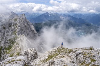 Mountaineer on the Waxenstein with fog, Wetterstein Mountains, Garmisch-Patenkirchen, Bavaria,