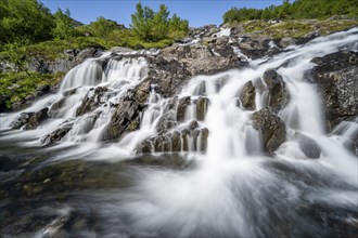 Lofoten waterfall on the hiking trail to Munkebu hut, long exposure, Moskenesoya, Lofoten,