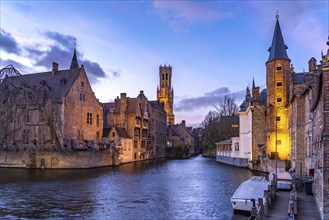 Rozenhoedkaai canal with belfry at dusk, Bruges, Belgium, Europe