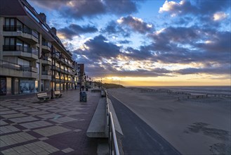 Sunset on the beach promenade of De Haan, Belgium, Europe