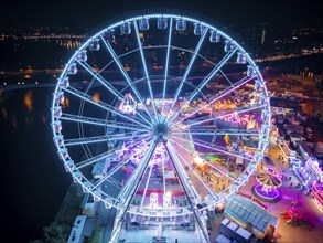 A 55m high illuminated Ferris wheel is the landmark of the fair at the Volksfest grounds on