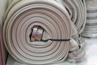 High pressure fire hose in coil