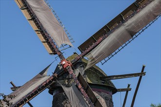 Close-up of the wings of an old windmill in front of a blue sky, Xanten, Lower Rhine, North