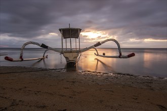 Jukung in the sea, typical landscape shot with a view of the horizon over the water, taken from a
