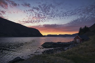 Sunset on the fjord of Selje Norway. very beautiful colors reflected in the clouds and the water.