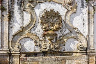 Old fountain in baroque art and carved in stone in the responsible for bringing water to the city