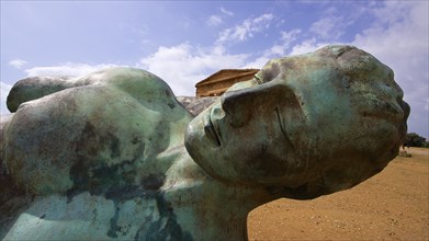 Bronze statue of fallen Icarus, deatil, head, Concordia temple, valley of the temples, valle dei