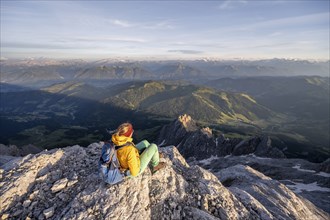 Hiker looking down into the valley from the Hochkönig, Tyrol, Austria, Europe