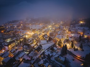 Snow-covered Seiffen with the mountain church