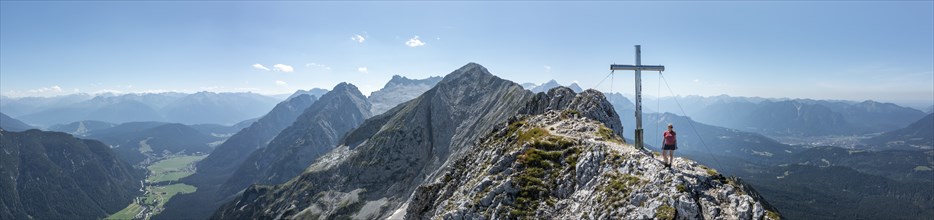 Alpine panorama, hikers at the summit cross, Westliche Wettersteinspitze, Bavaria, Germany, Europe