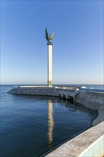 Sculpture of winged Mayan Angel on tall column, the seafront Malecon, Campeche city, Campeche