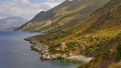 Cloudy weather, coastline, green coastal mountains, small bay, pebble beach, bathers, Zingaro,