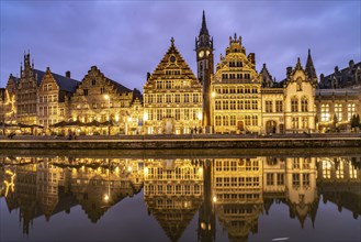 Medieval guild houses of Graslei Kai on the river Leie at dusk, Ghent, Belgium, Europe