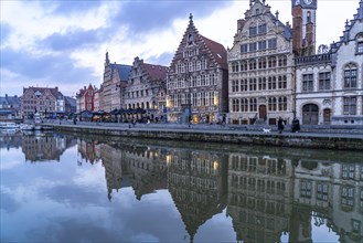 Medieval guild houses of Graslei Kai on the river Leie at dusk, Ghent, Belgium, Europe