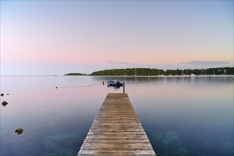 Jetty with boat at sunrise, Adriatic Sea, Rovinj, Istria, Croatia, Europe