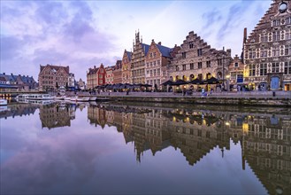 Medieval guild houses of Graslei Kai on the river Leie at dusk, Ghent, Belgium, Europe