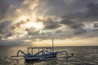 Jukung in the sea, typical landscape shot with a view of the horizon over the water, taken from a