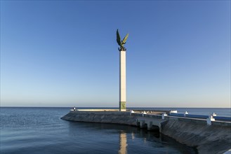 Sculpture of winged Mayan Angel on tall column, the seafront Malecon, Campeche city, Campeche