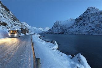 With motorhome on the E10 at Flakstadpollen in winter, Lofoten, Norway, Europe