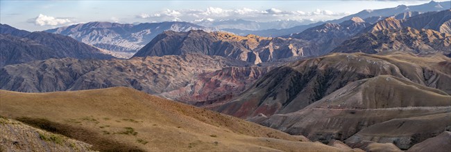 View over eroded mountainous landscape with brown hills, mountains and steppe, Chuy province,