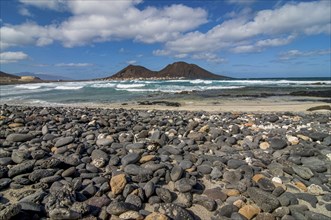 Vulcanic cone and beach with pebbles. San Vincente. Cabo Verde. Africa