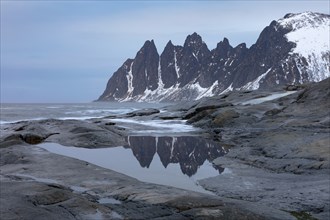 Devil's teeth mountain range (Djevelens tanngard) at Tungeneset rest area, Senja Island, Norway,