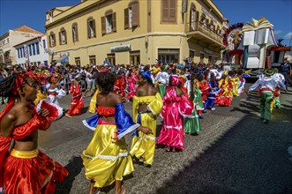 Colourful costumed, pretty women are dancing. Carnival. Mindelo. Cabo Verde. Africa