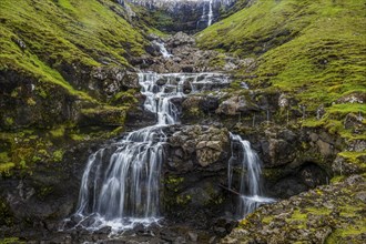 Waterfall tumbling down the hill, Streymoy, Faroe islands, Denmark, Europe