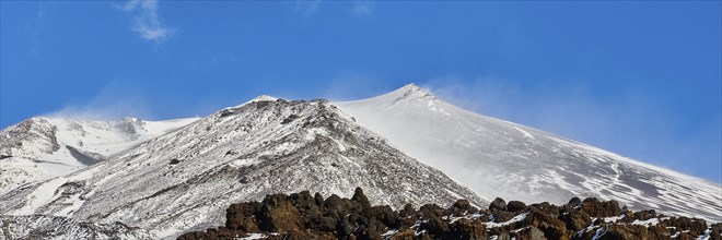 Lava scree, snow-capped peaks, blue sky, white clouds, Etna, volcano, Eastern Sicily, Sicily,