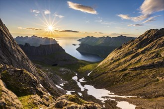 View over Senja's fjords and mountain peaks under the midnight sun, Mount Grytetippen, Senja,