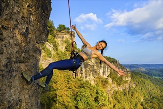 Climbers in Rathen in Saxon Switzerland