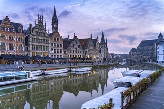 Medieval guild houses of Graslei Kai on the river Leie at dusk, Ghent, Belgium, Europe