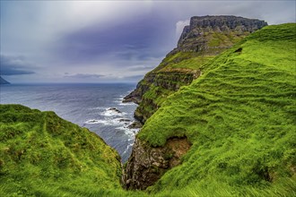 Huge cliffs in Gasadalur, Vagar, Faroe islands, Denmark, Europe