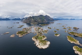 Aerial view, Henningsvaer with football pitch, rocky islands in the sea off Bergen, Festvagtinden,