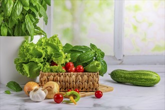 Fresh vegetables in basket, salad ingredients, cucumber, tomatoes, lettuce, basil, pepperoni,