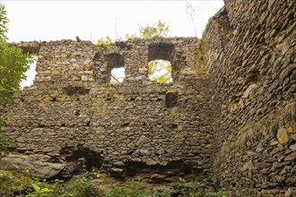 Kempe Castle is the ruin of a late medieval rock castle on a slate cliff directly above the