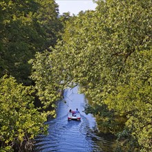 Couple in a pedal boat on the river Lahn, Marburg, Hesse, Germany, Europe